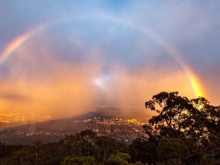 Disaster recovery marketing - Photo of rainbow over Australian town after rain