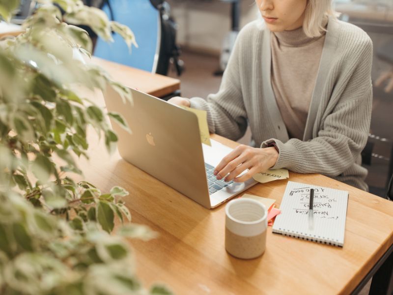 Write great email subject lines that will improve email open rate - woman sitting at desk typing