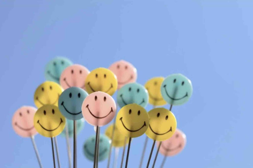 Smiling faces on plastic lollypop sticks
