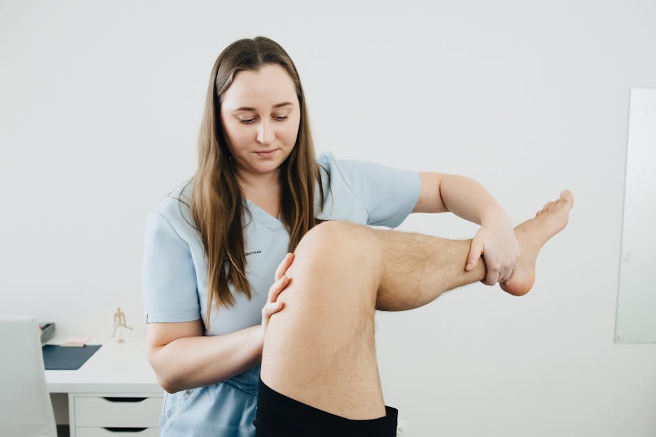 Physiotherapist working with a patient in a friendly clinic environment